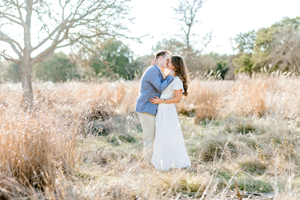 Hill Country Engagement Photo in Tall Grass, Gricelda's Photography